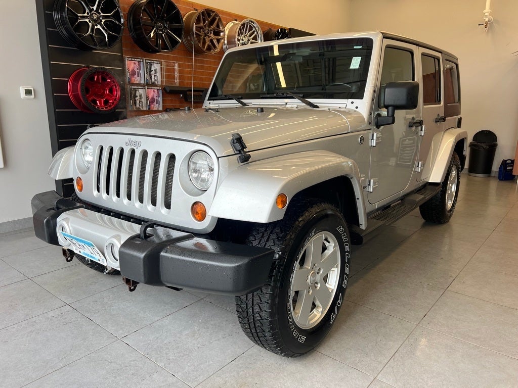 Used 2011 Jeep Wrangler Unlimited Sahara with VIN 1J4BA5H16BL592841 for sale in Monticello, Minnesota