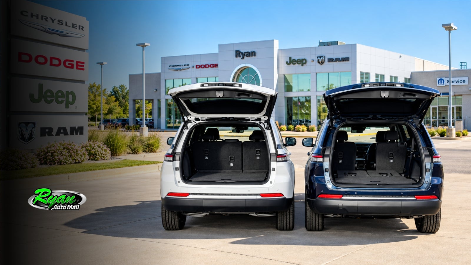 White Jeep Grand Cherokee and blue Grand Cherokee L with liftgates open at Ryan CDJR Monticello